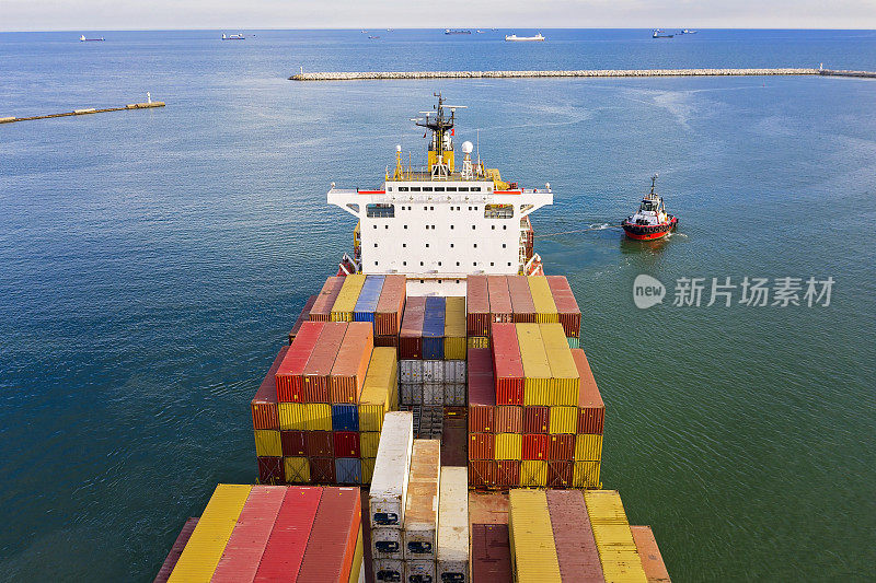 Aerial view of freight ship with cargo containers.